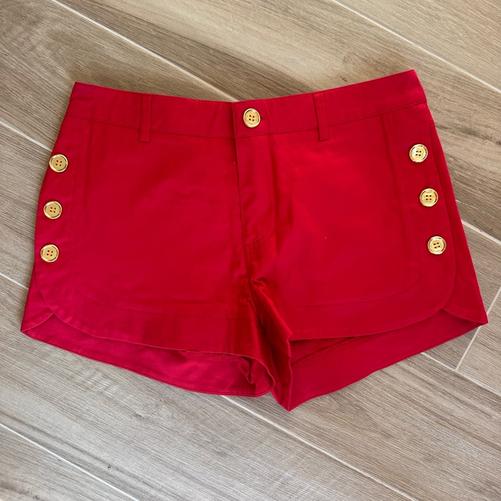 Red shorts with gold buttons. Size 7.
